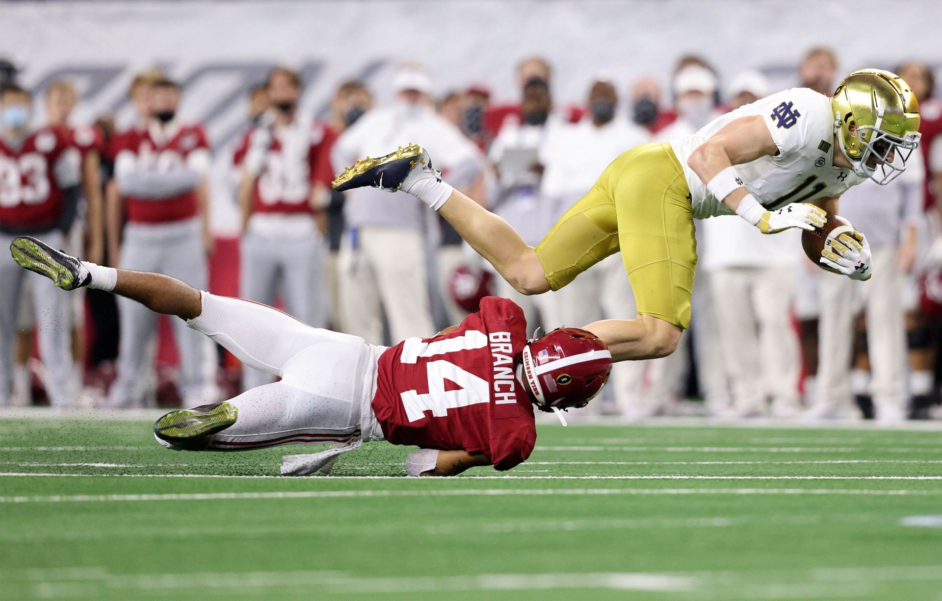 Ben Skowronek #11 of the Notre Dame Fighting Irish is tackled by Brian Branch