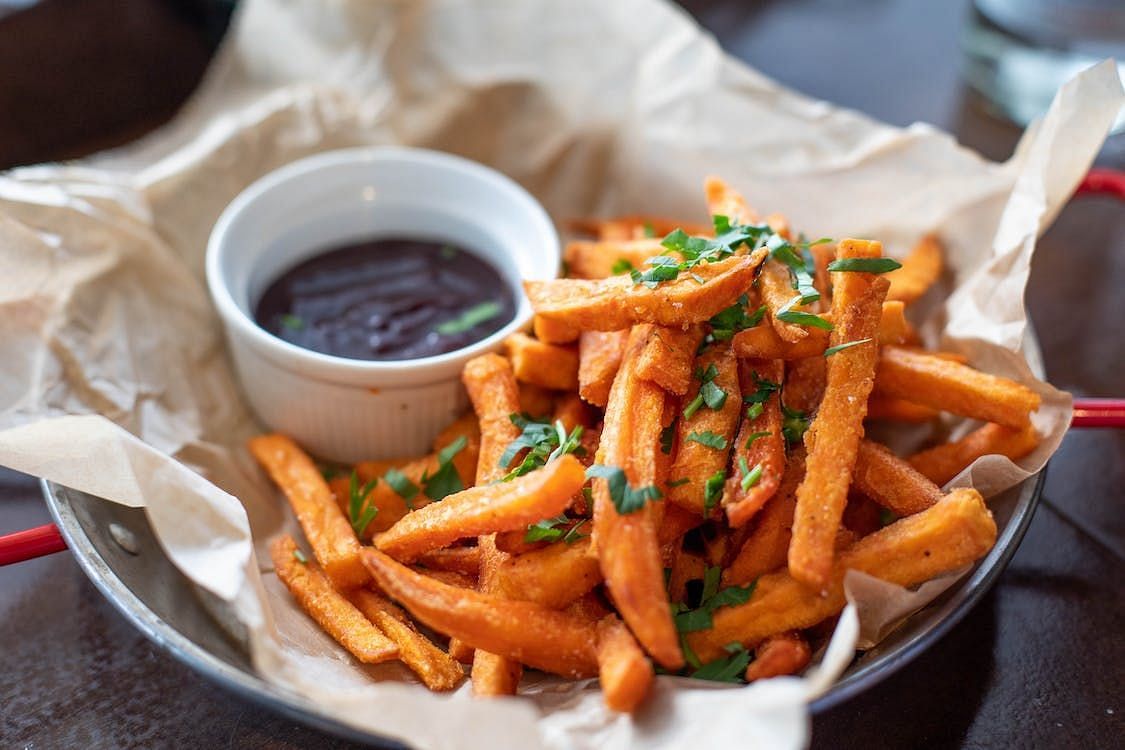 Instead of regular French fries, opt for sweet potato fries. Sweet potatoes are a great source of vitamins and mineral (Valeria Boltneva/ Pexels)