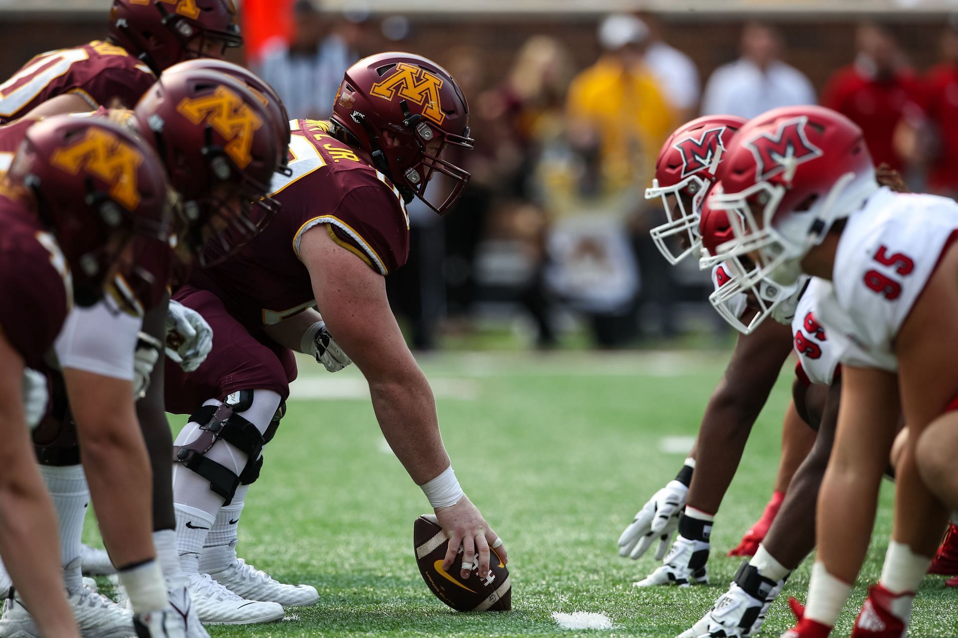 John Michael Schmitz #60 of the Minnesota Golden Gophers lines up against the Miami (Oh) Redhawks