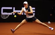 Iga Swiatek in action at the Porsche Tennis Grand Prix