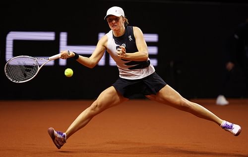 Iga Swiatek in action at the Porsche Tennis Grand Prix