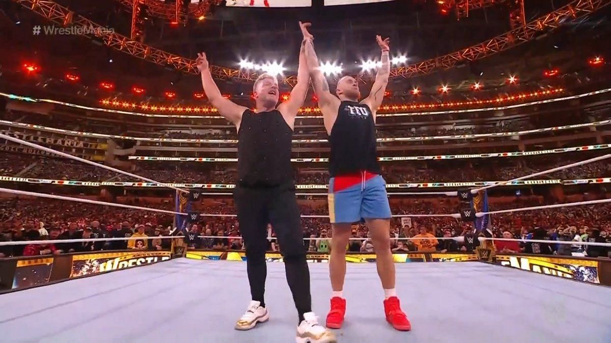 Pat McAfee and George Kittle celebrate during WrestleMania 39 (image credit: Wrestling News)