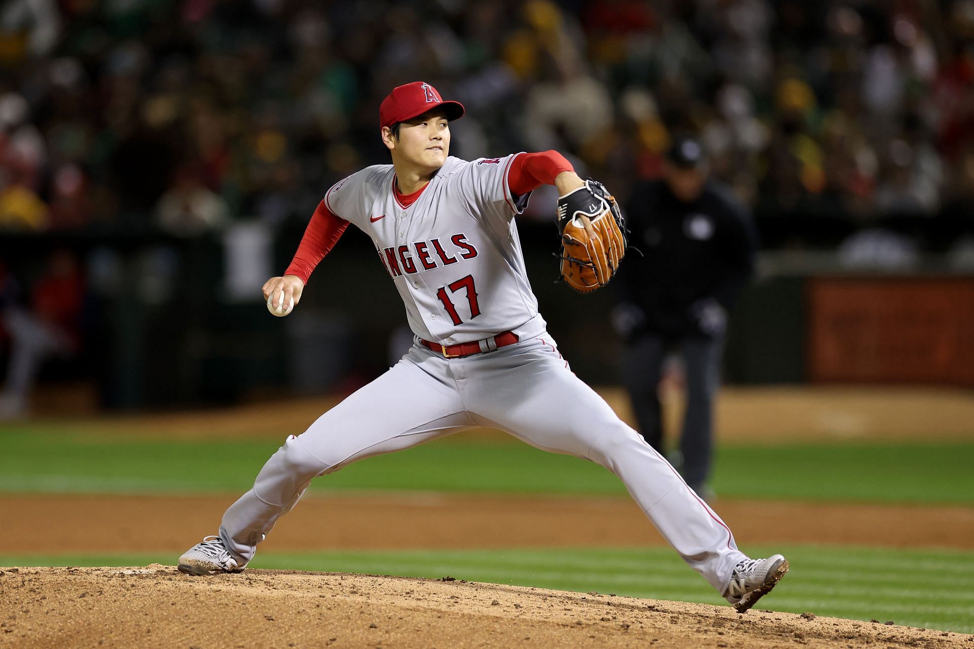 Shohei Ohtani of the Los Angeles Angels pitches against the Oakland Athletics on opening day at RingCentral Coliseum