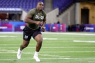 Defensive lineman Adetomiwa Adebawore of Northwestern participates in a drill during the NFL Combine