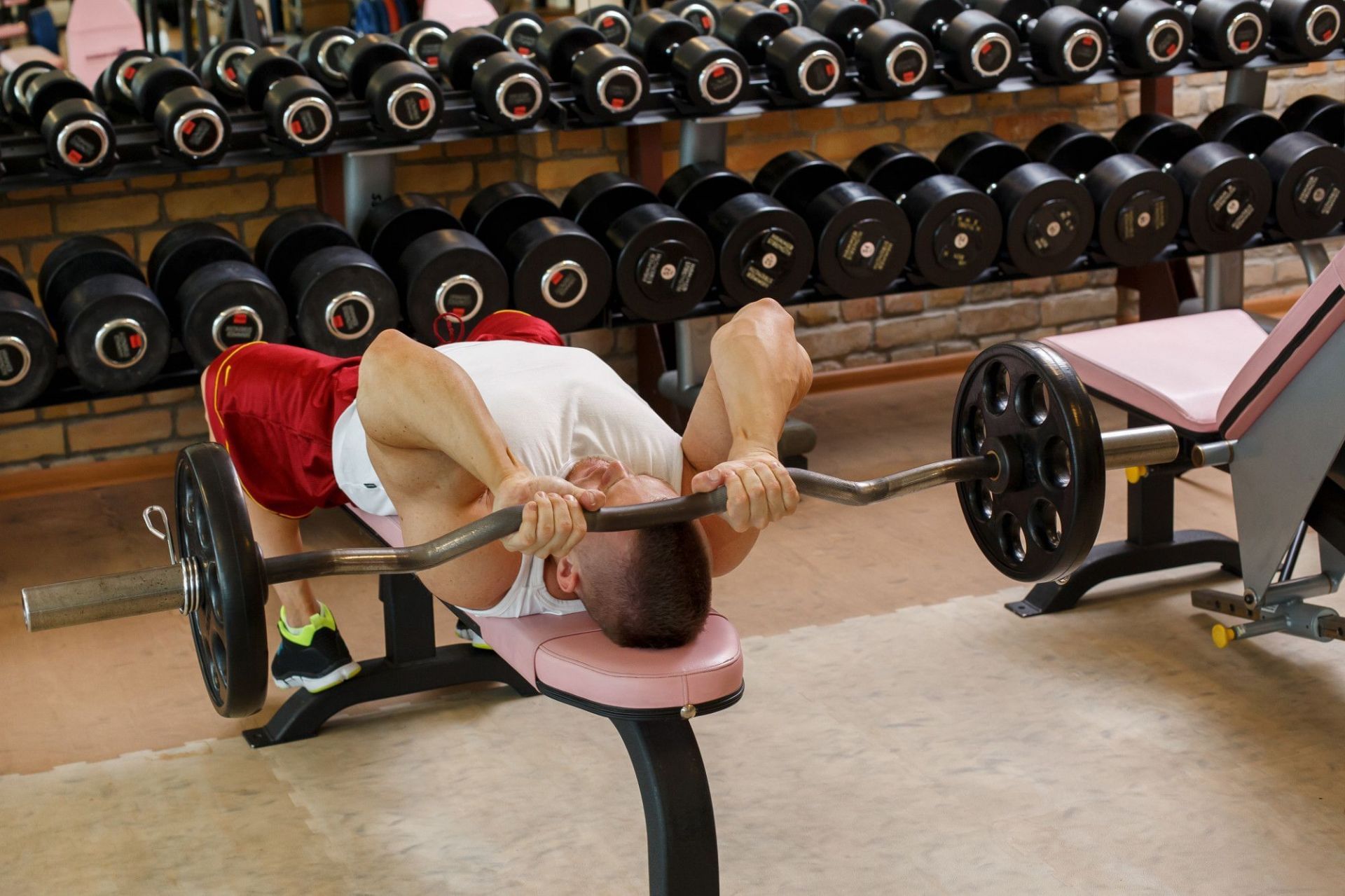  The barbell pullover is a variation of the traditional pullover (Image via Freepik/ Racool_Studio)