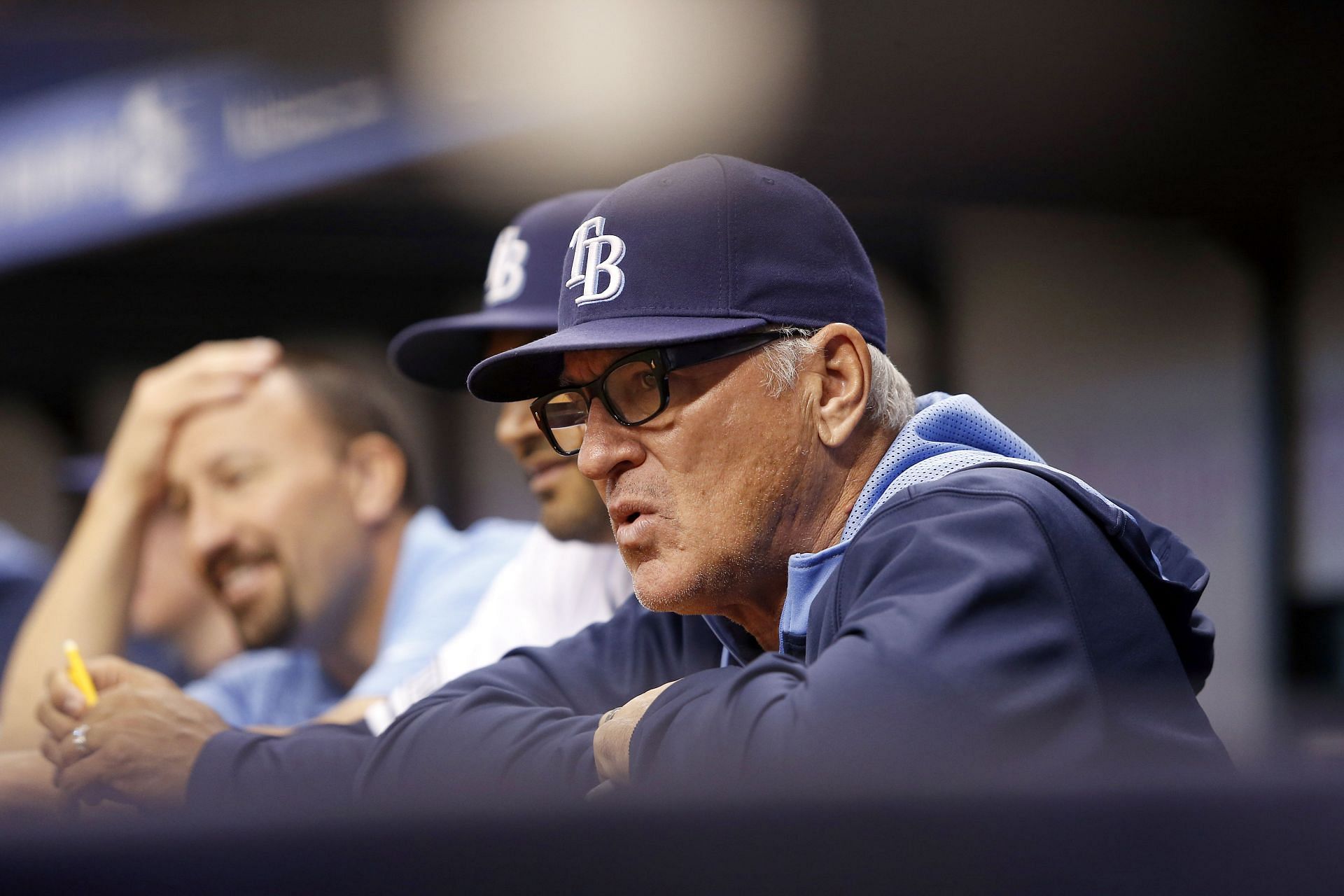 Manager Joe Maddon of the Tampa Bay Rays looks on from the dugout.