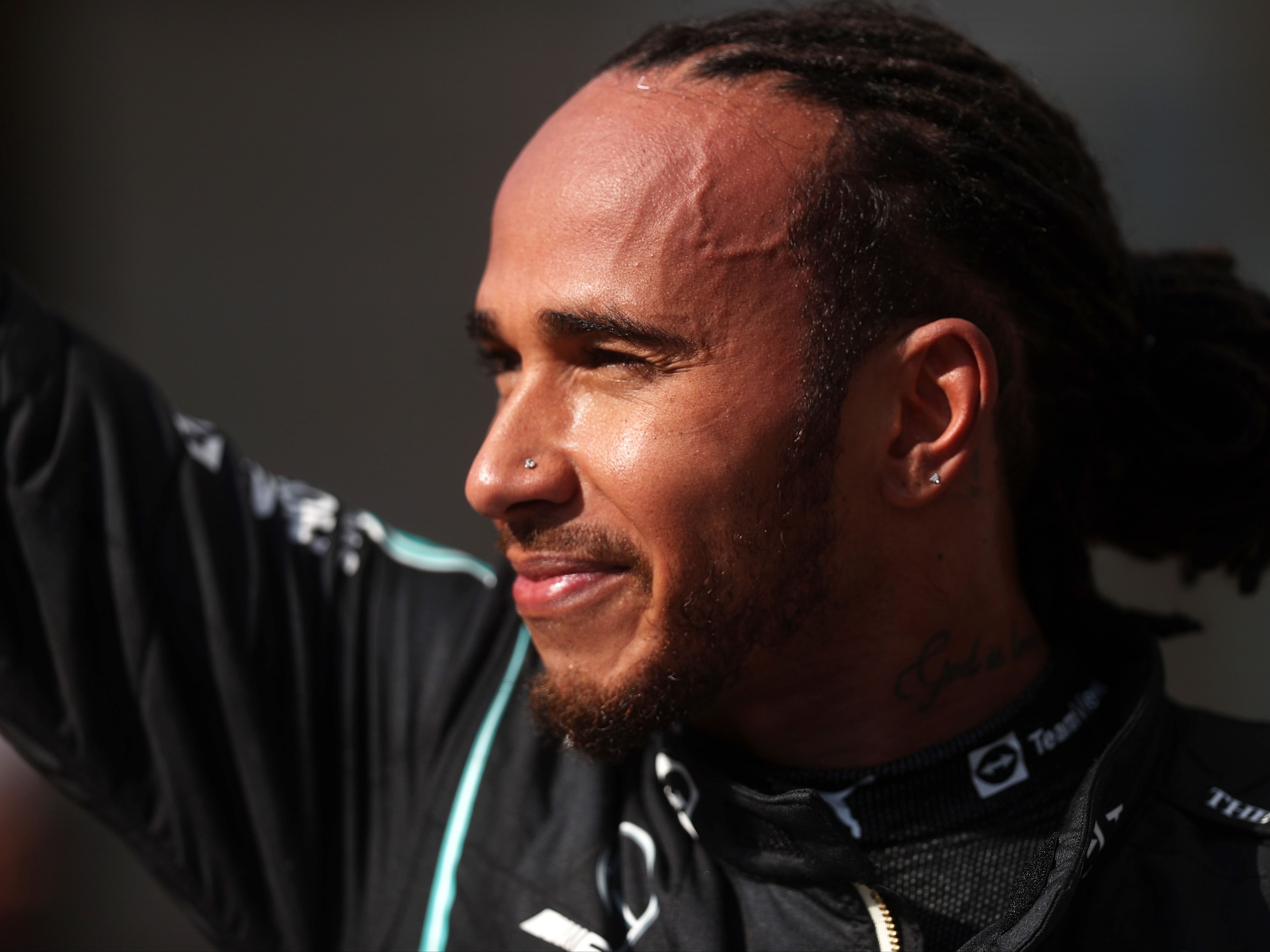 Lewis Hamilton celebrates in parc ferme during the 2021 F1 Brazilian Grand Prix. (Photo by Lars Baron/Getty Images)