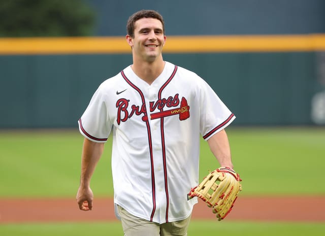 Who threw out first pitch at the Braves game tonight?