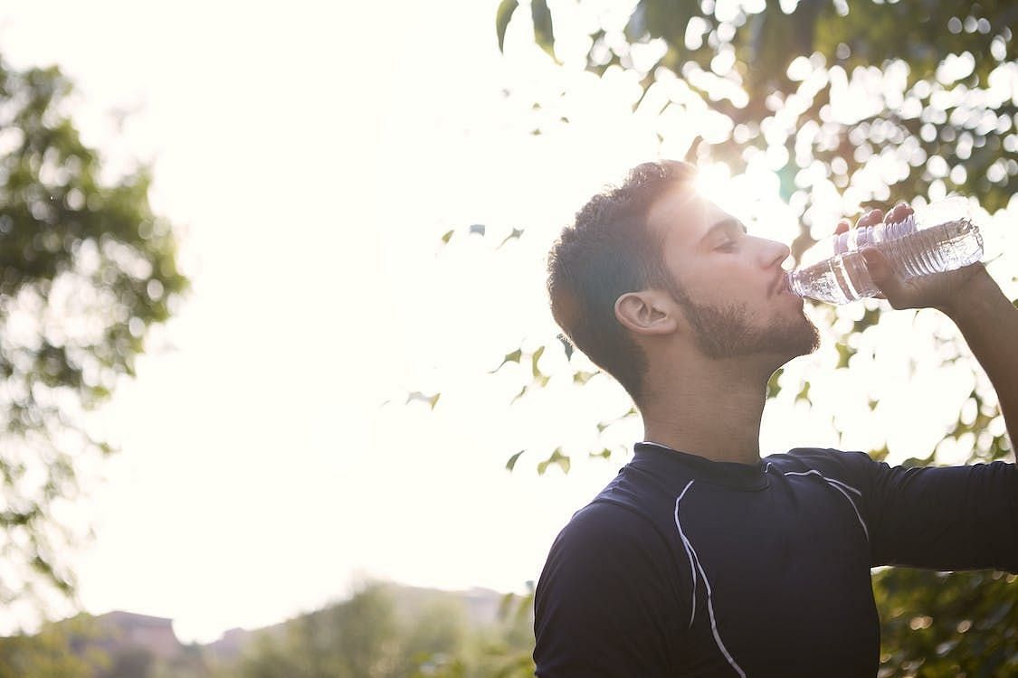 Drink water before, during, and after your workout to stay hydrated (Andrea Piacquadio/ Pexels)