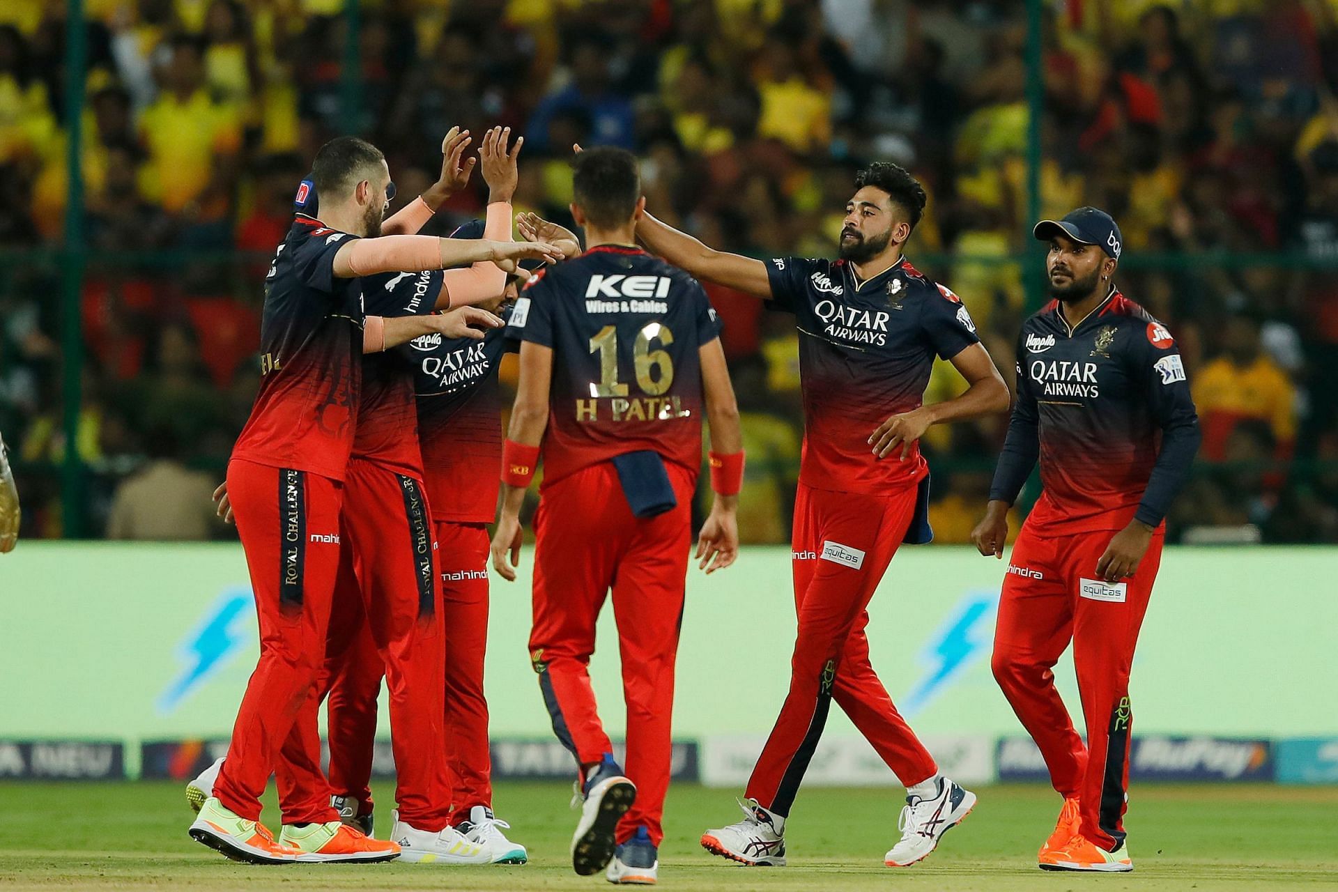 Royal Challengers Bangalore players celebrate the wicket of Shivam Dube during the IPL 2023 match between Royal Challengers Bangalore and Chennai Super Kings