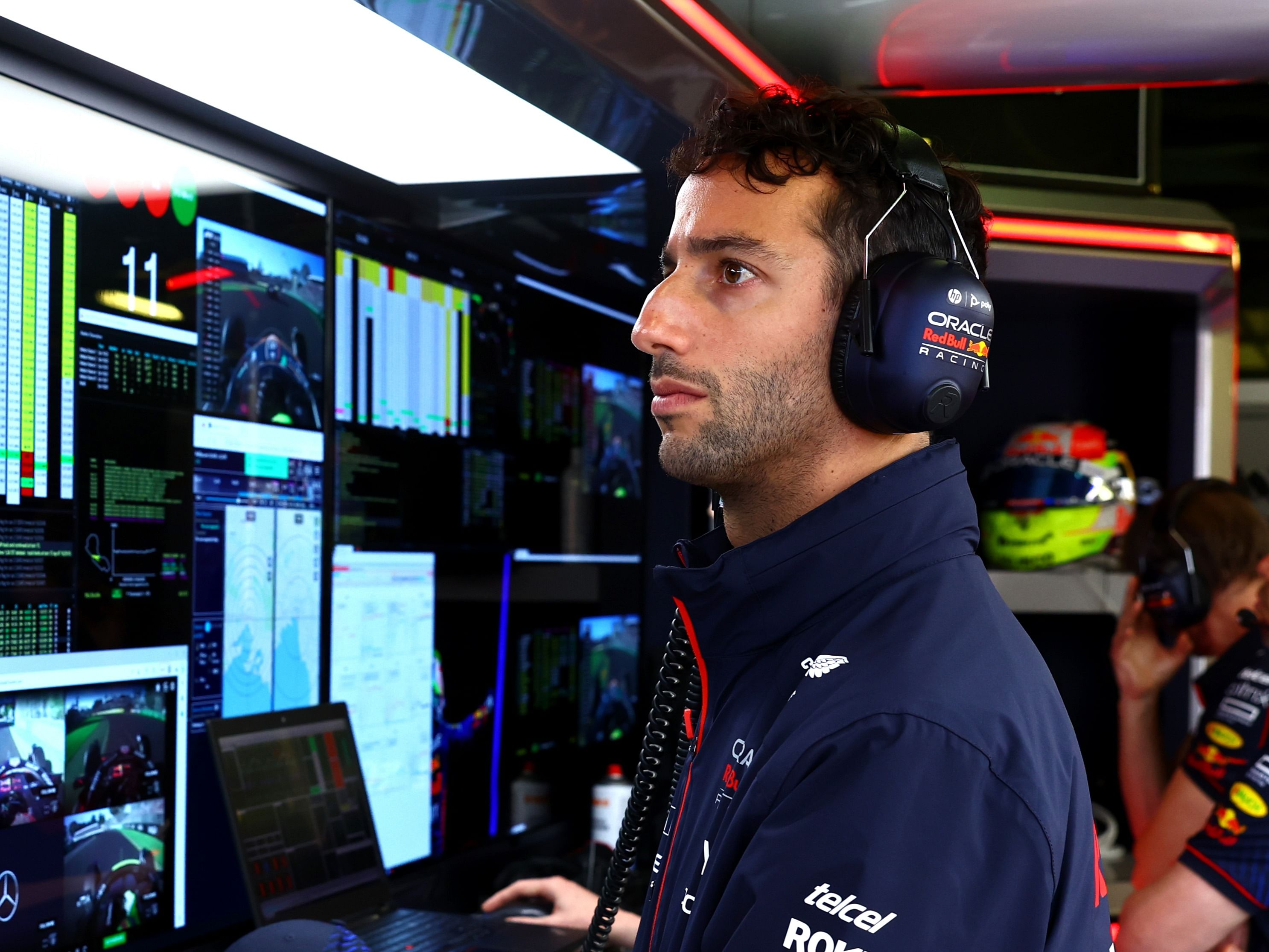 Daniel Ricciardo watches the action in the Red Bull Racing garage during the 2023 F1 Australian Grand Prix. (Photo by Mark Thompson/Getty Images)