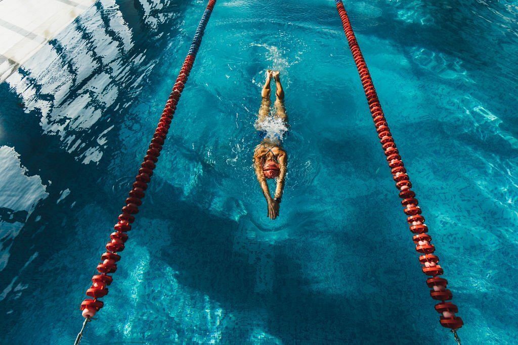 Swimming workout in pool. Clear and blue water surface. Healthy lifestyle, sportive hobby(Image via Getty Images)