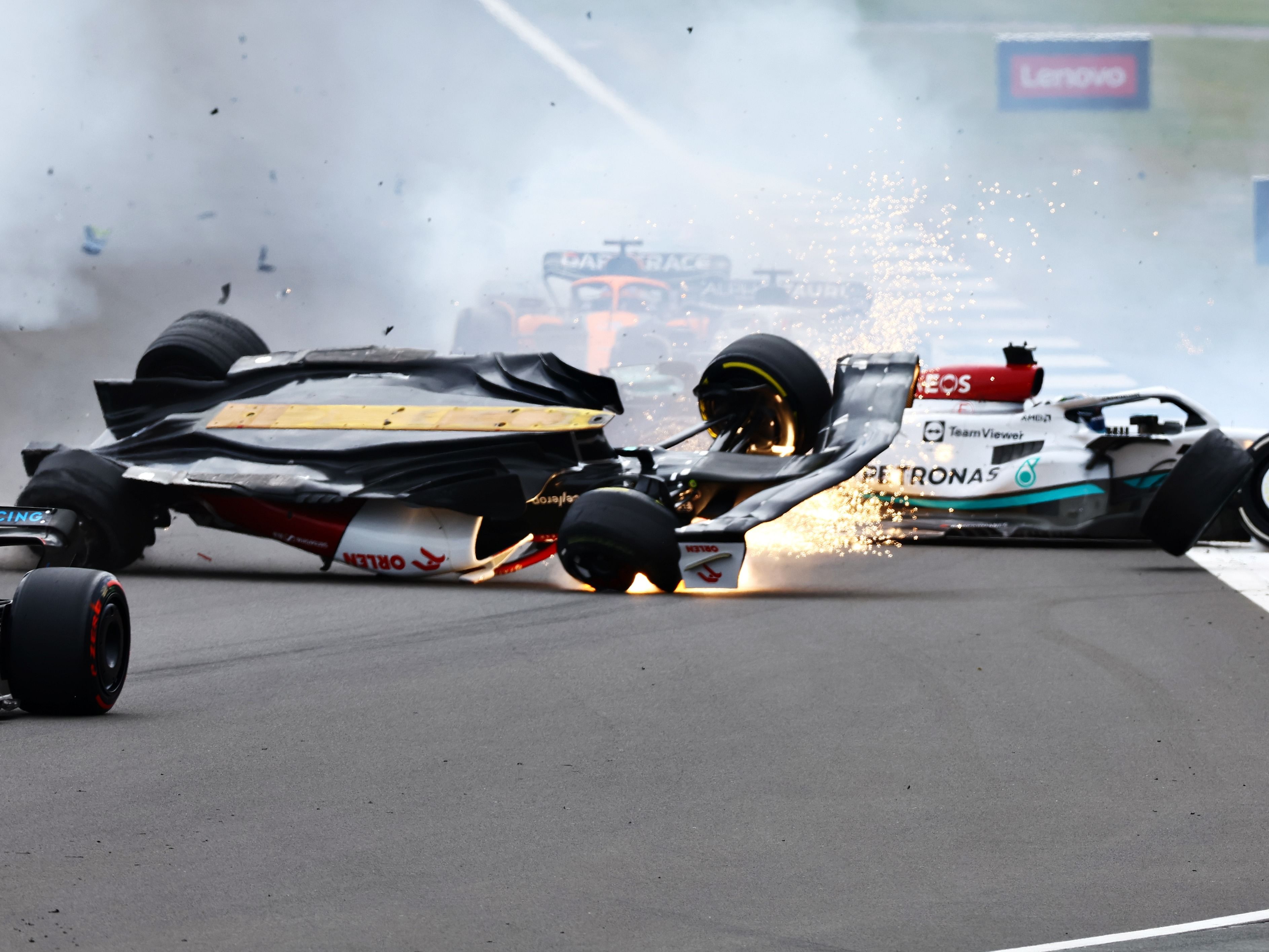 Zhou Guanyu (24) crashes at the start during the 2022 F1 British Grand Prix. (Photo by Mark Thompson/Getty Images)