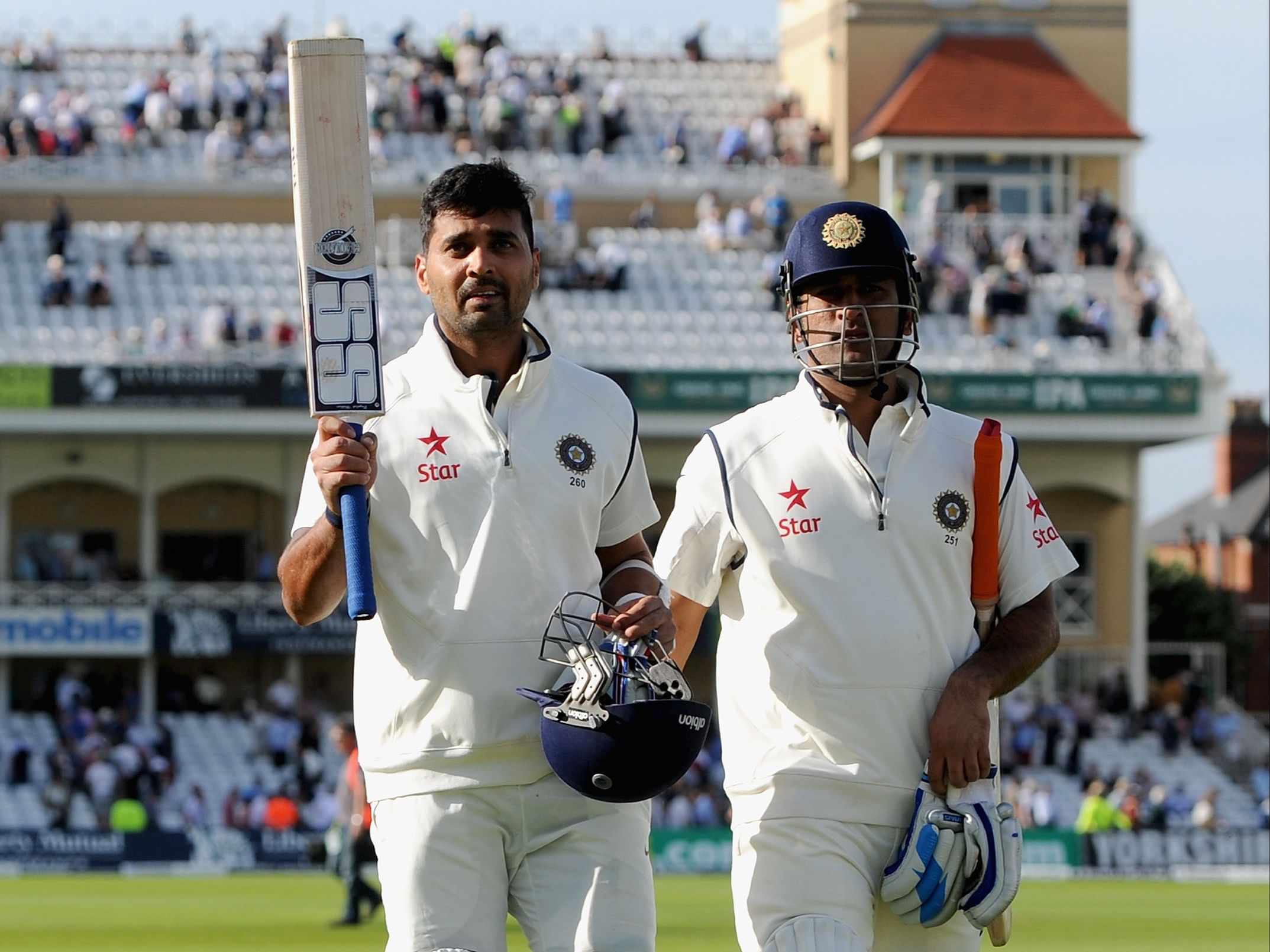 Murali Vijay walks back with MS Dhoni after notching up a century in the Trent Bridge Test of 2014