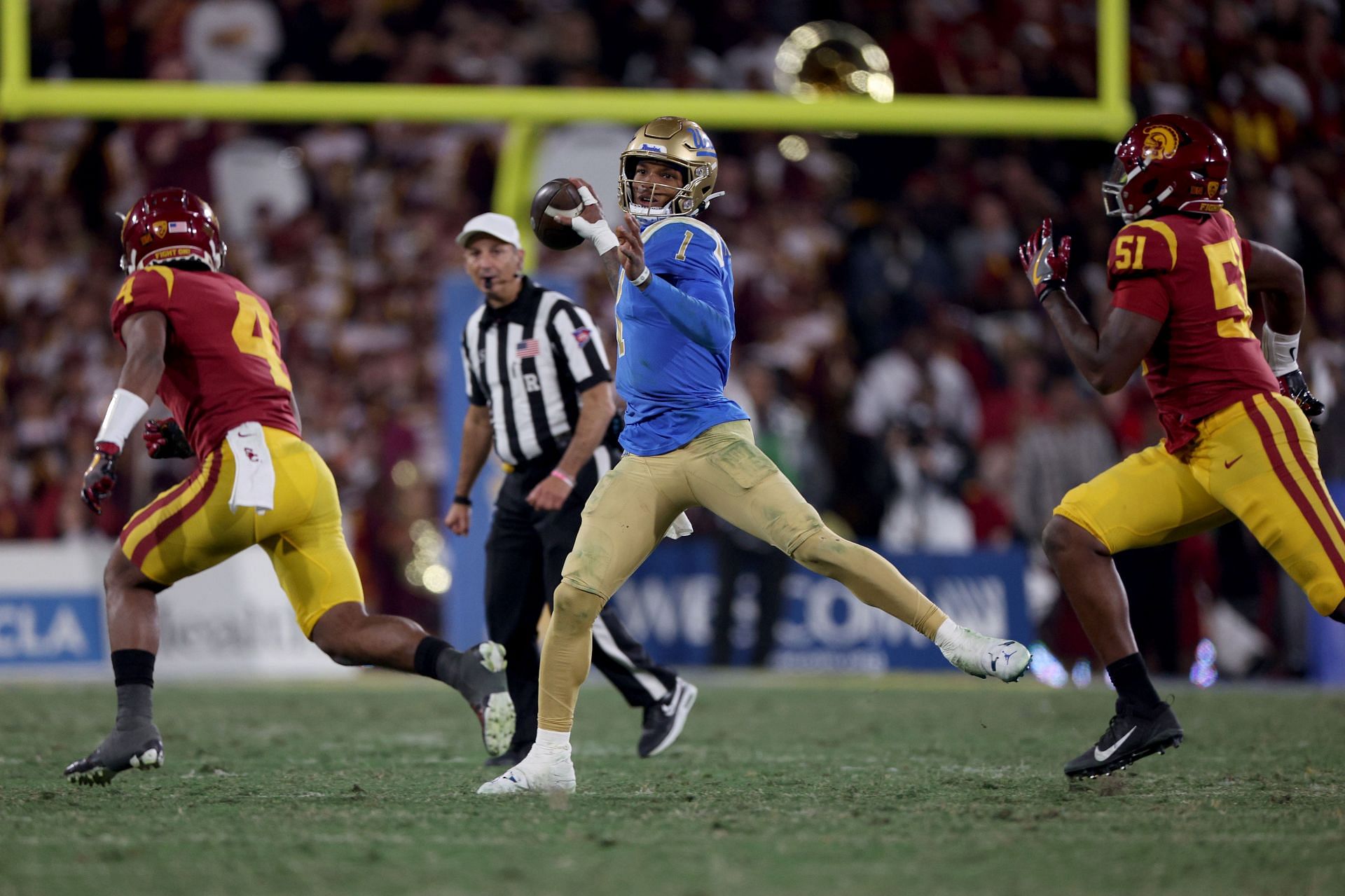 Dorian Thompson-Robinson #1 of the UCLA Bruins throws a pass against the USC Trojans 