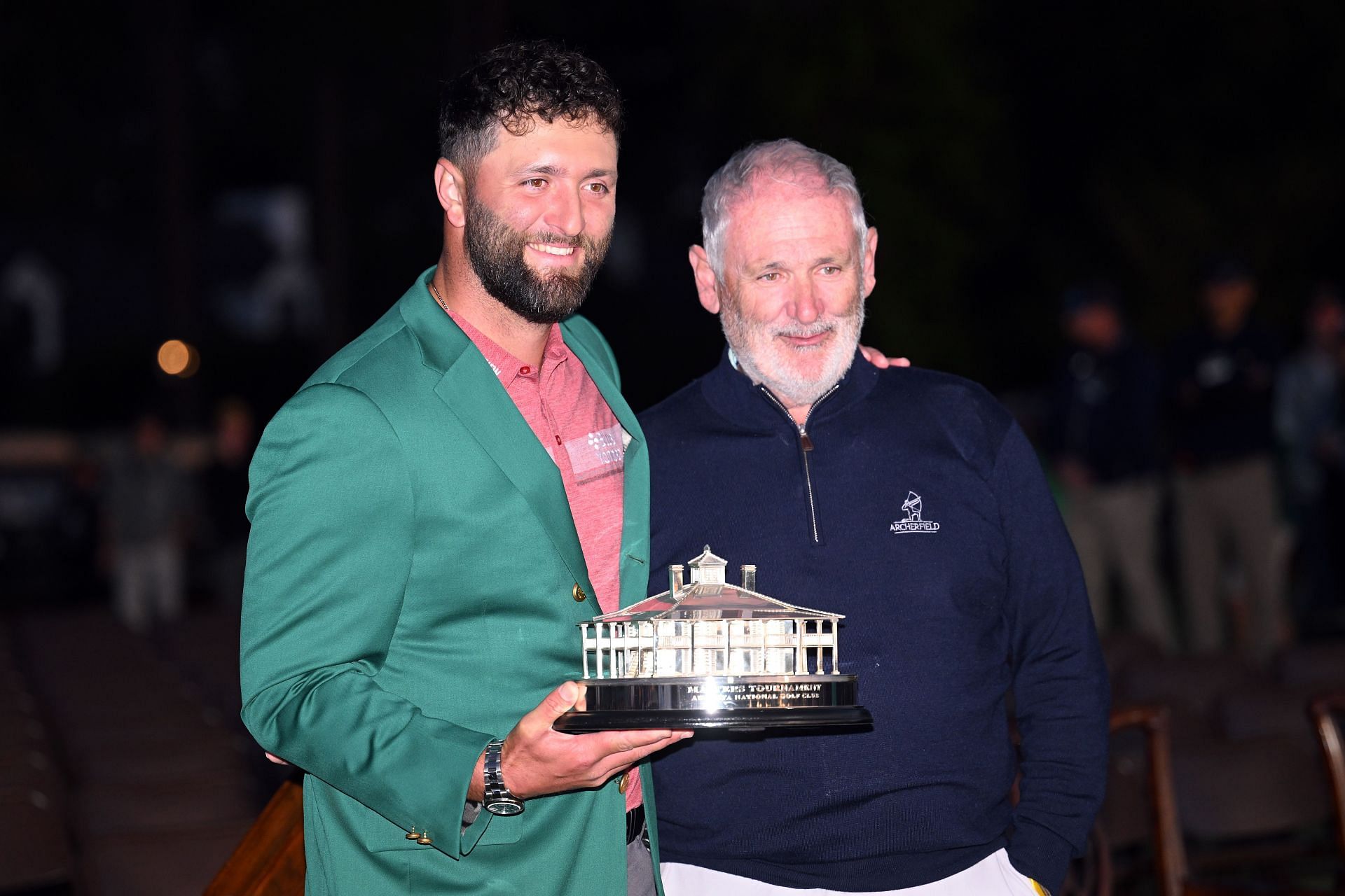 Jon Rahm poses with the Masters trophy alongside his father Edorta Rahm