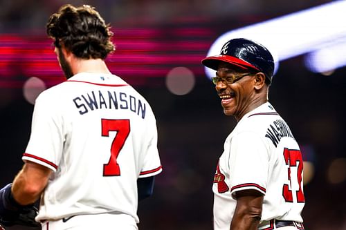 Third base coach Ron Washington (37) of the Atlanta Braves talking to shortstop Dansby Swanson #7 at third base during a game against the Philadelphia Phillies at Truist Park (Photo by Casey Sykes/Getty Images)