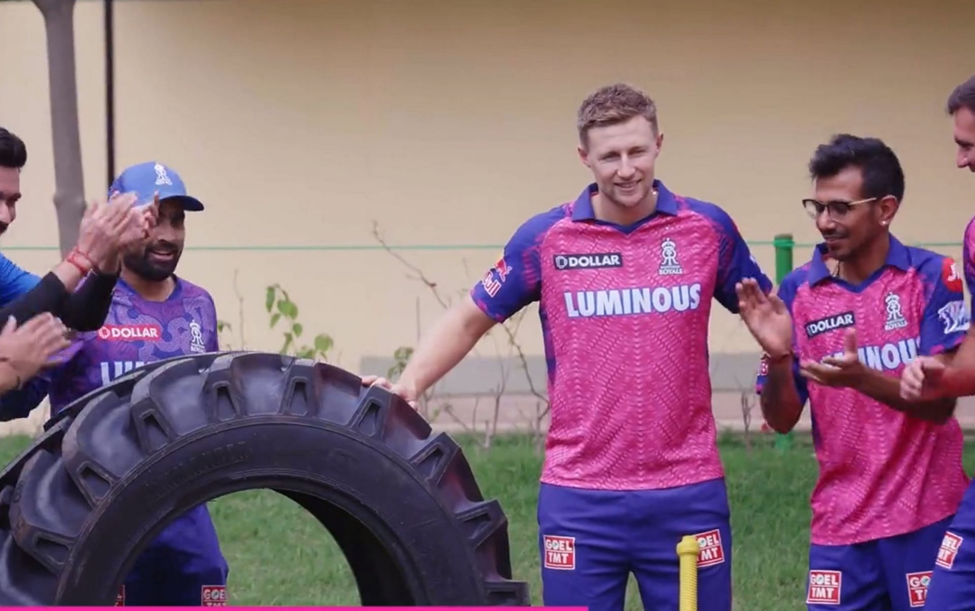Joe Root with Yuzvendra Chahal and other RR players. 