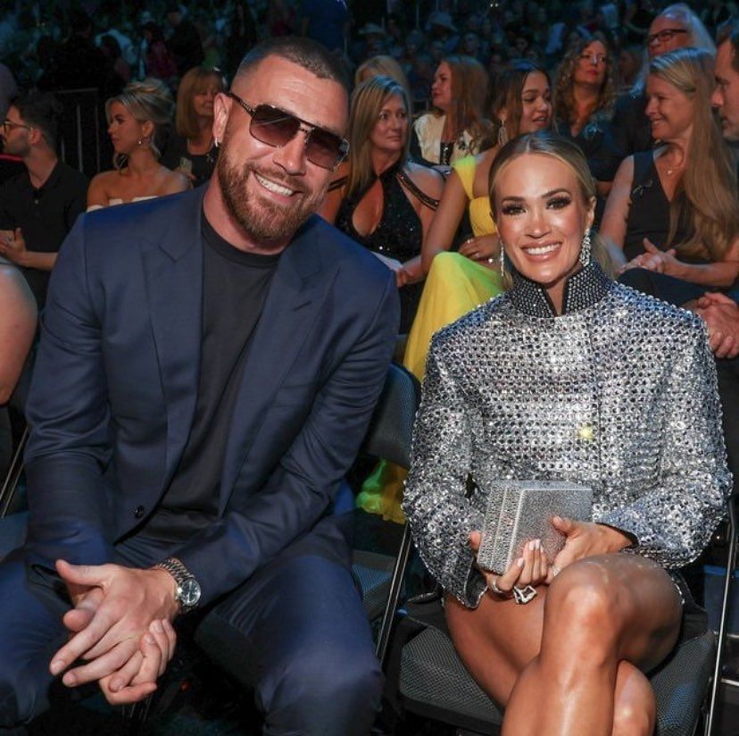 Travis Kelce Soars in Heeled Boots & Navy Suit at CMT Awards 2023