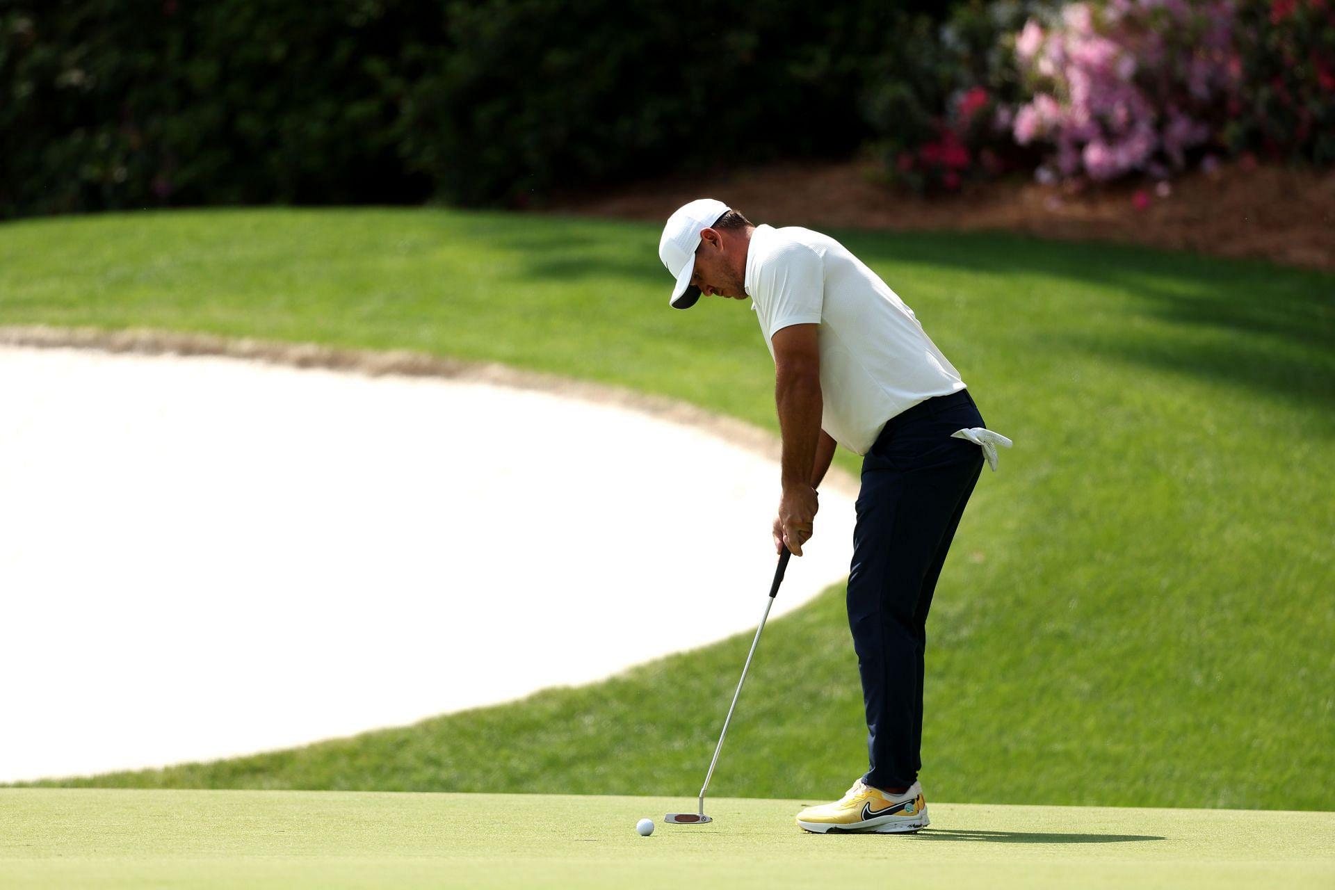 Brooks Koepka putts on the 13th green during The Masters 2023, Round Two