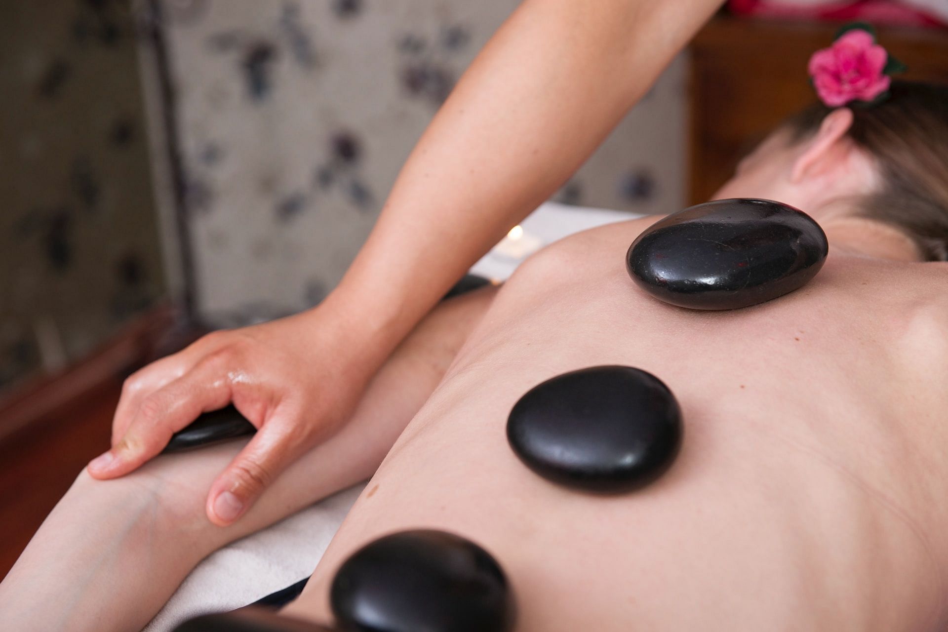 Benefits of hot stone massage. (Photo via Engin Kurt/Unsplash)