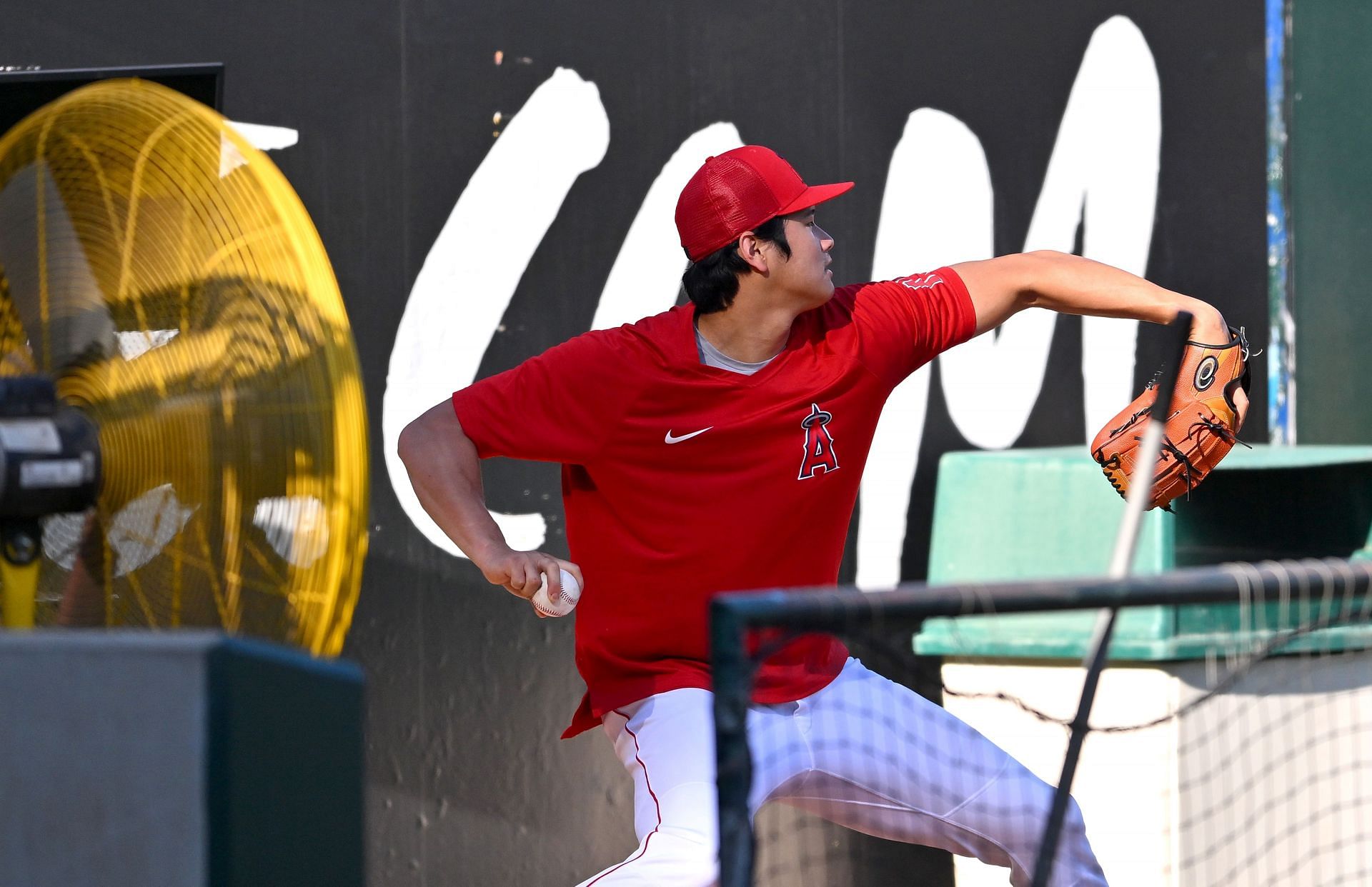 Shohei Ohtani of the Los Angeles Angels throws in the bullpen prior to the game against the Seattle Mariners at Angel Stadium of Anaheim