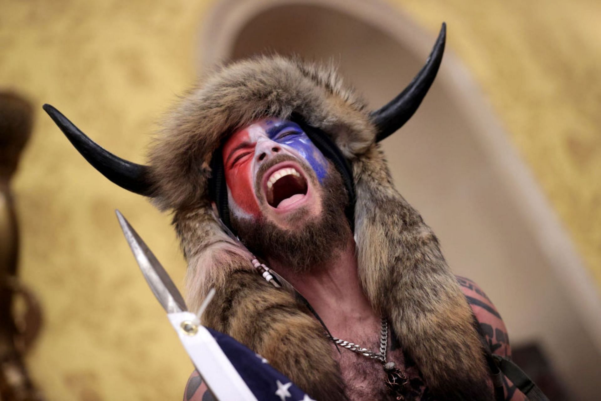 QAnon Shaman at the United States Capitol building on January 6, 2021. (Image via Getty Images)