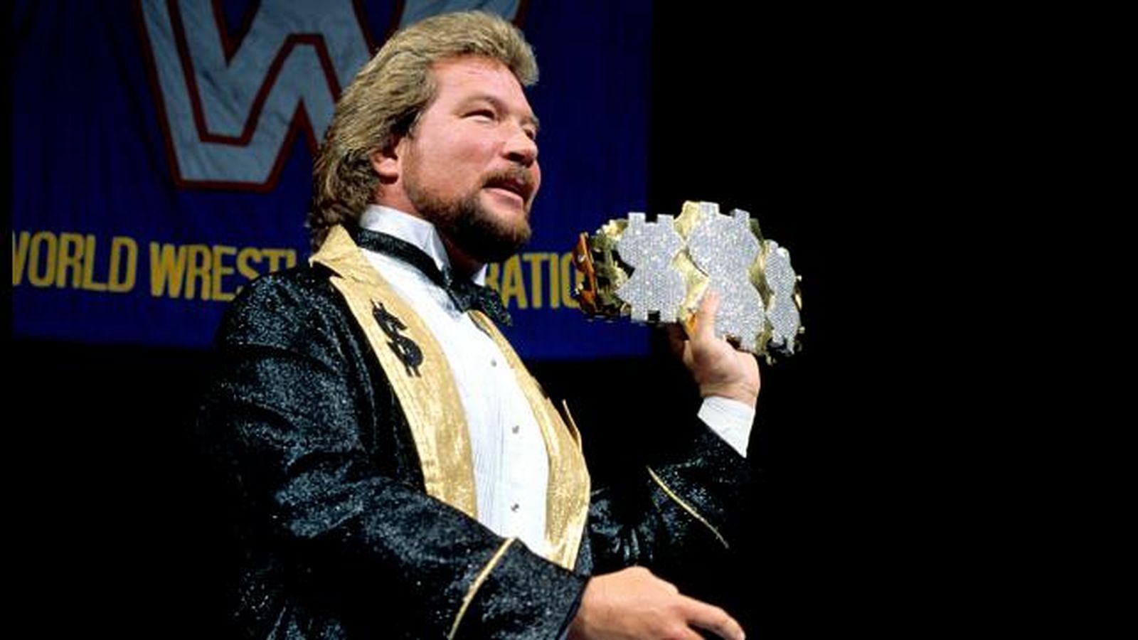 Ted DiBiase with the title he made famous.