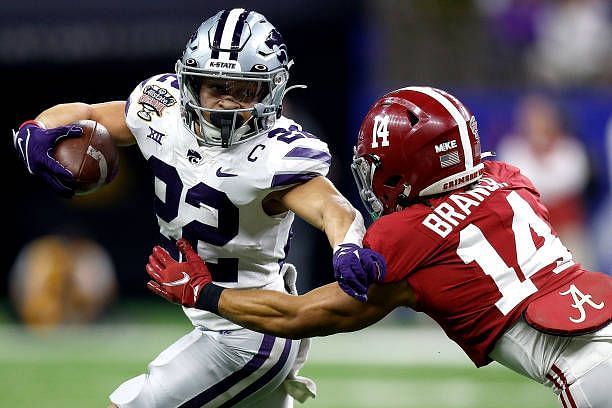 LA: Allstate Sugar Bowl - Alabama v Kansas State : Deuce Vaughn #22 of the Kansas State Wildcats is tackled by Brian Branch #14 of the Alabama Crimson Tide during the first quarter of the Allstate Sugar Bowl at Caesars Superdome (Photo by Sean Gardner/Getty Images)
