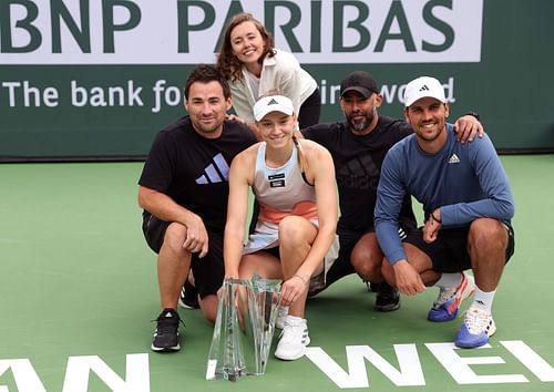 Elena Rybakina poses with her team and her sister Anna