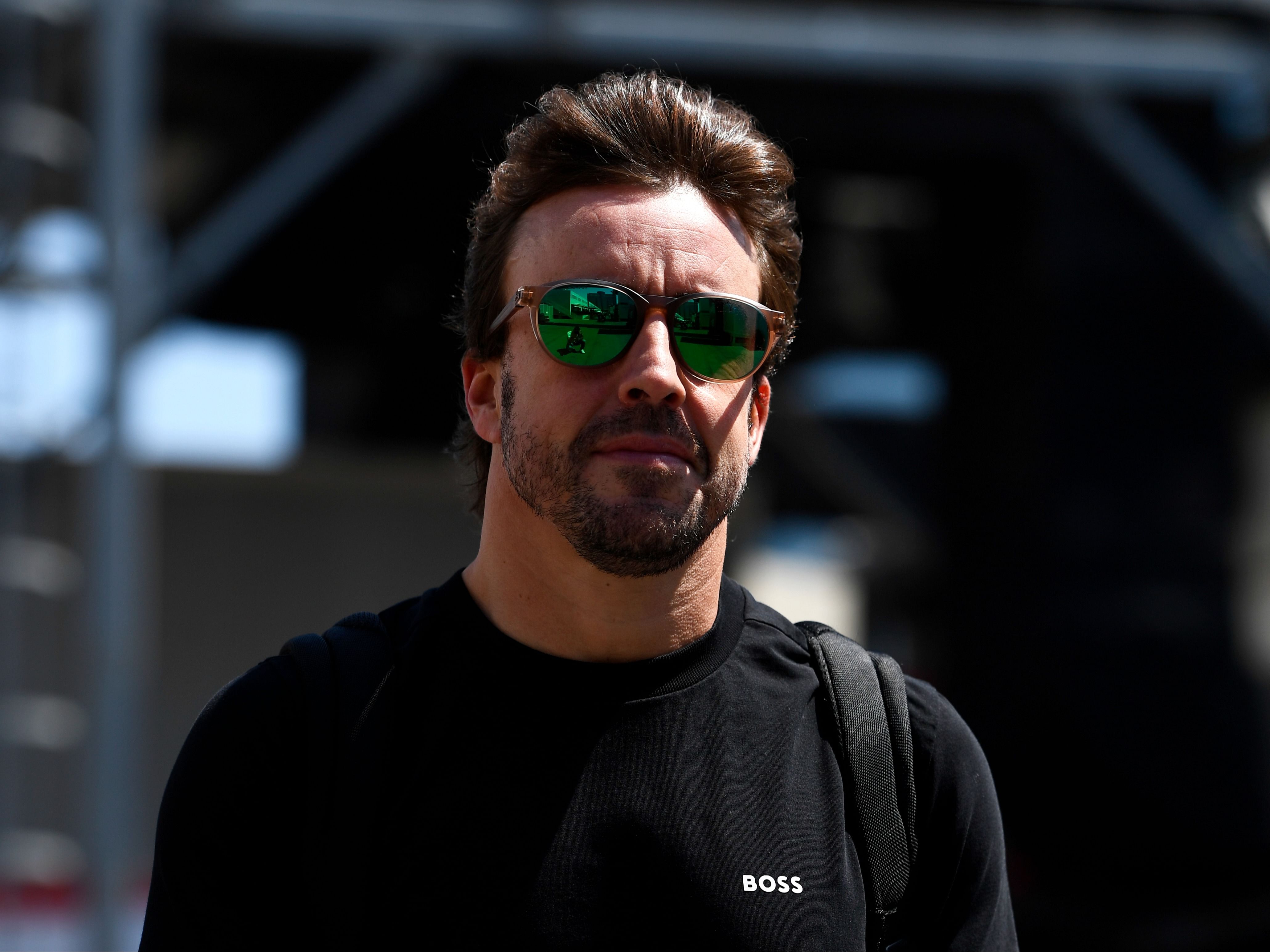 Fernando Alonso looks on in the paddock during previews ahead of the 2023 F1 Azerbaijan Grand Prix. (Photo by Rudy Carezzevoli/Getty Images)