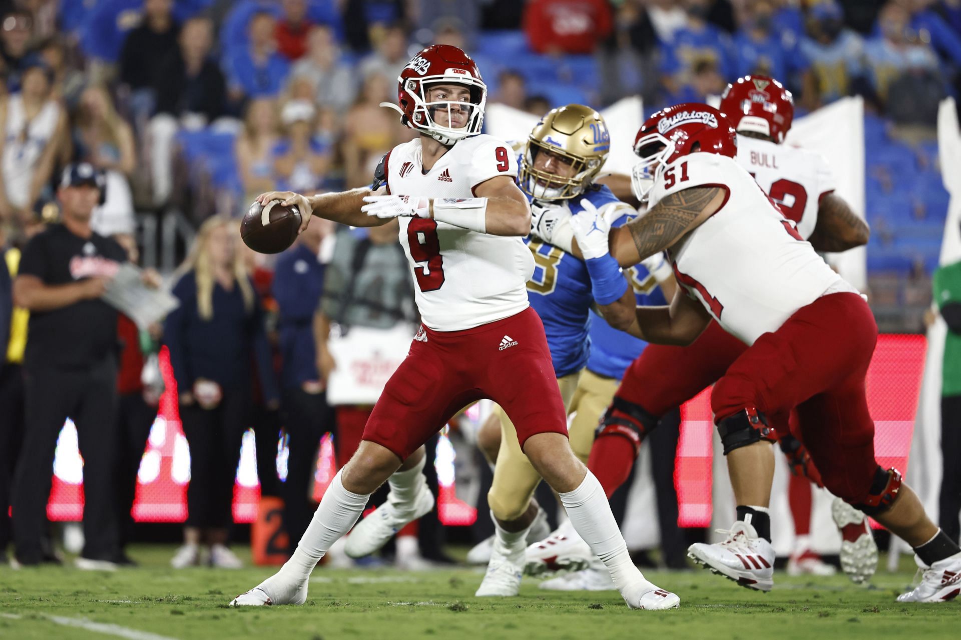  Jake Haener #9 of the Fresno State Bulldogs passes against the UCLA Bruins