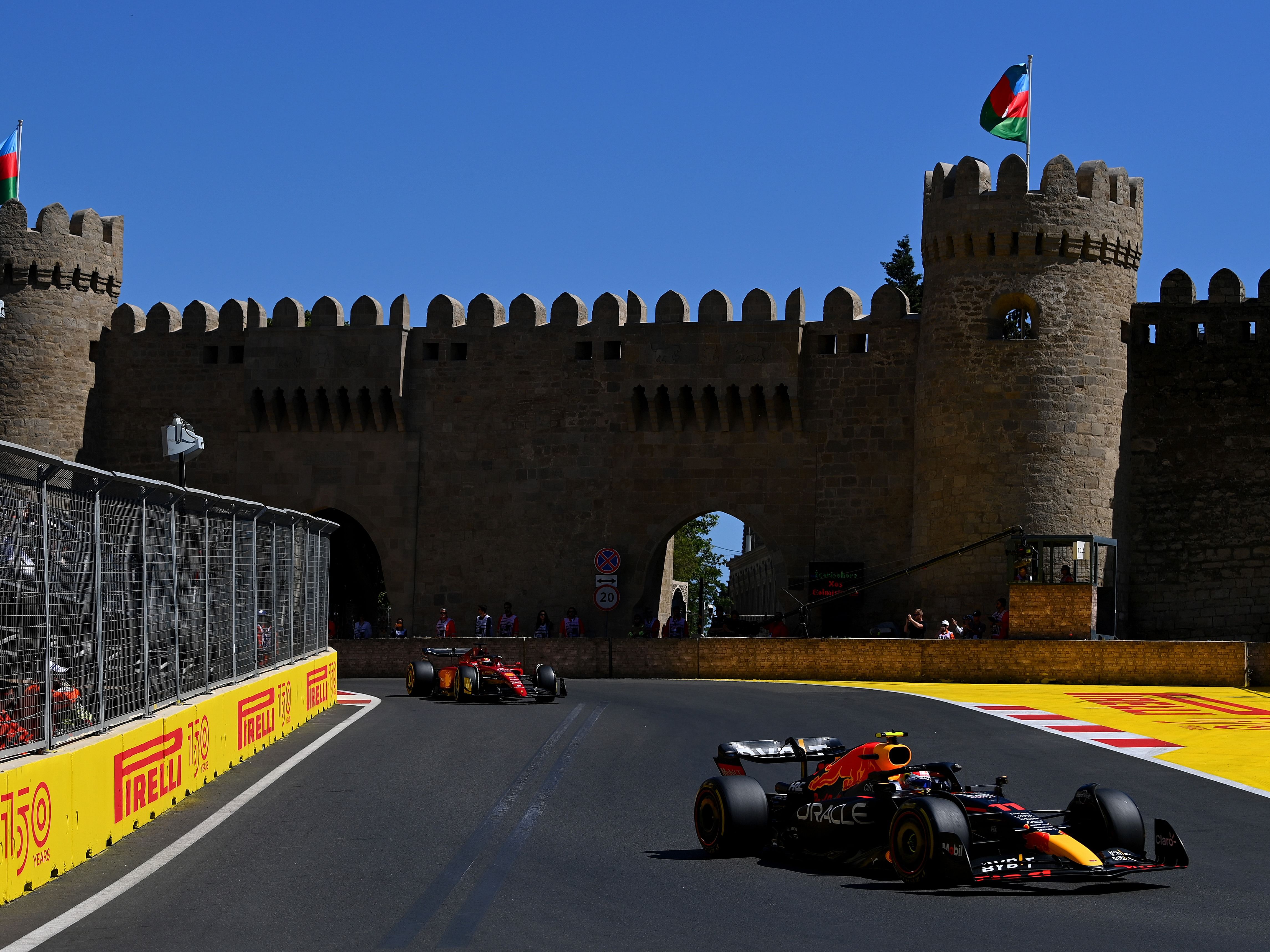 Sergio Perez (11) leads Charles Leclerc (16) on lap one during the 2022 F1 Azerbaijan Grand Prix. (Photo by Dan Mullan/Getty Images)