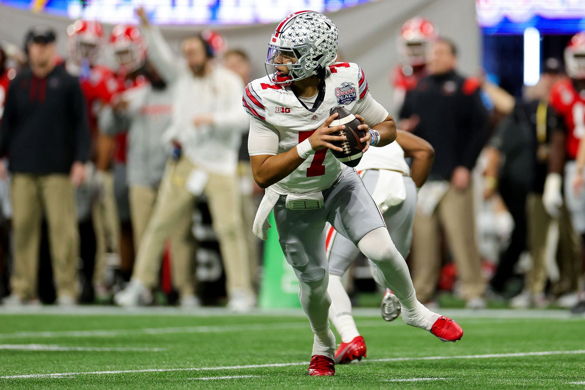 C.J. Stroud #7 of the Ohio State Buckeyes looks to pass during the first half against the Georgia Bulldogs