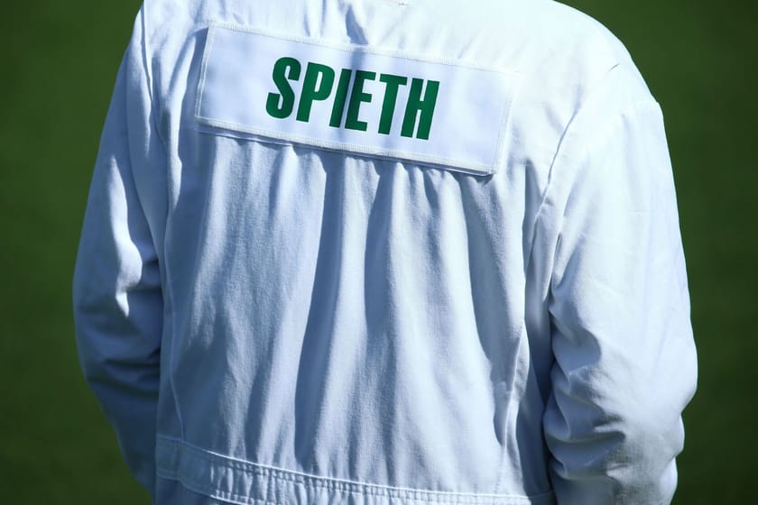 Why do caddies wear white boiler suits at the Masters?