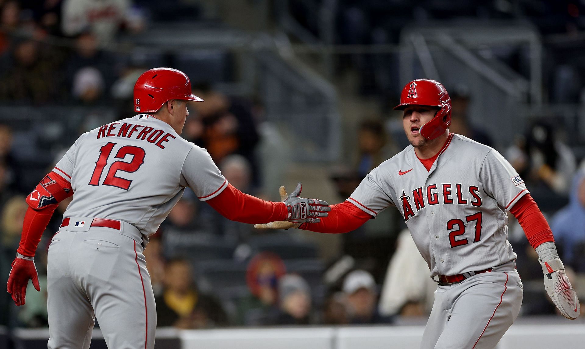 Mike Trout celebrates his run with on deck batter Hunter Renfroe against the New York Yankees at Yankee Stadium