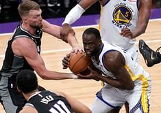 Draymond Green is ejected from Game 2 as he steps on Domantas Sabonis who was holding on to his leg