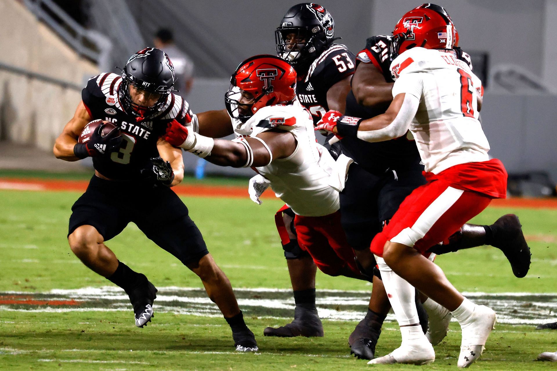 Tyree Wilson (center) attempting to tackle in Texas Tech v NC State