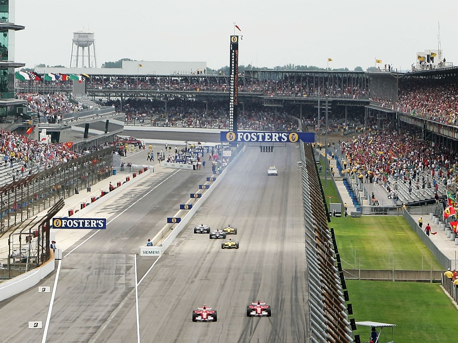 Only Ferrari, Minardi, and Jordan drivers race as the teams with Michelin tires all come into the pits to retire after one lap during the 2005 F1 United States Grand Prix. (Photo by Christopher Lee/Getty Images)