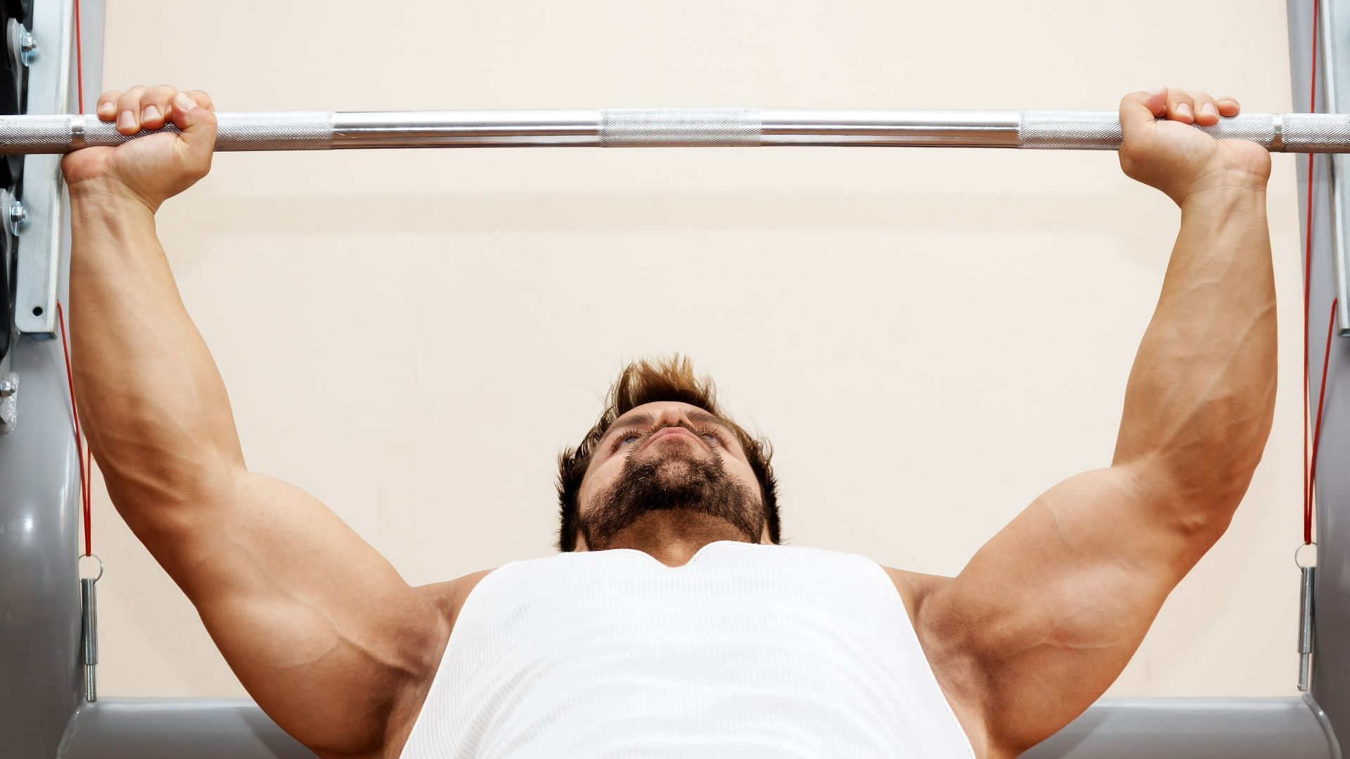 The flat bench press. (Image via Wallpaperflare.com)