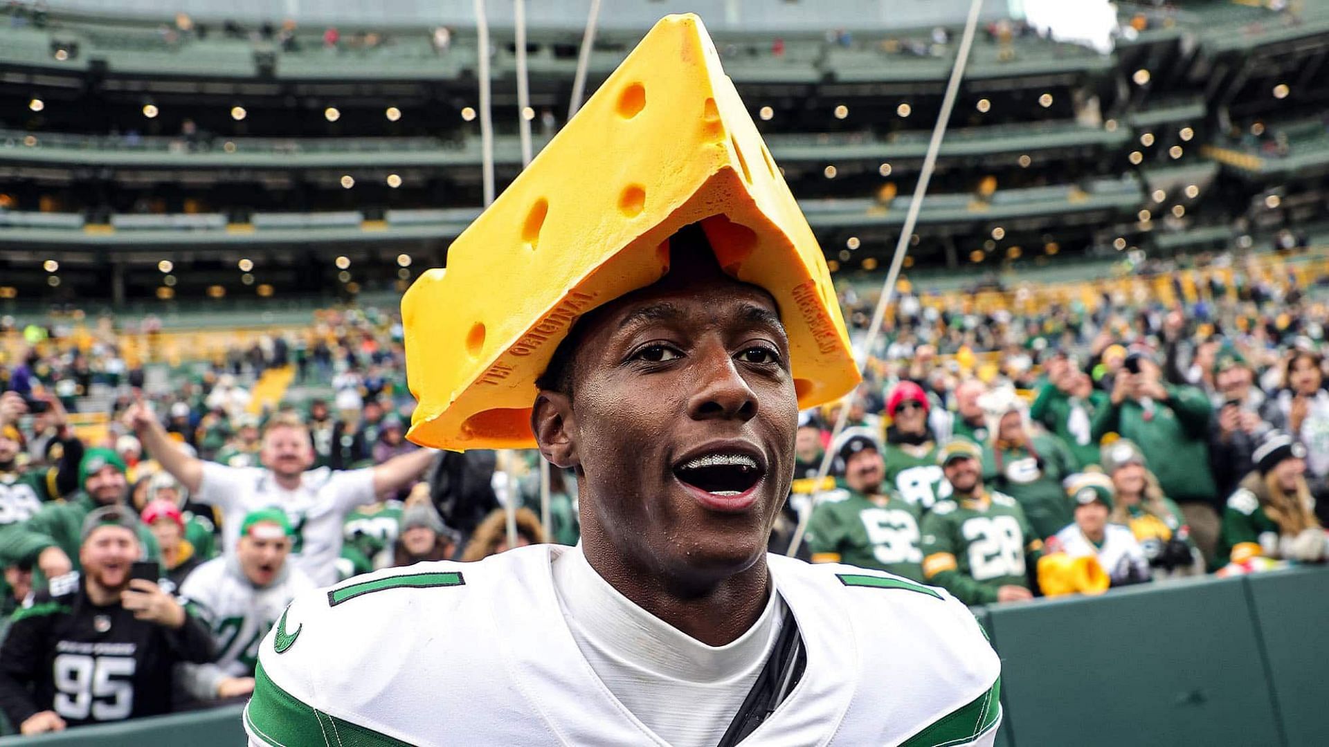 Sauce Gardner wearing a cheesehead after the Jets upset the Packers