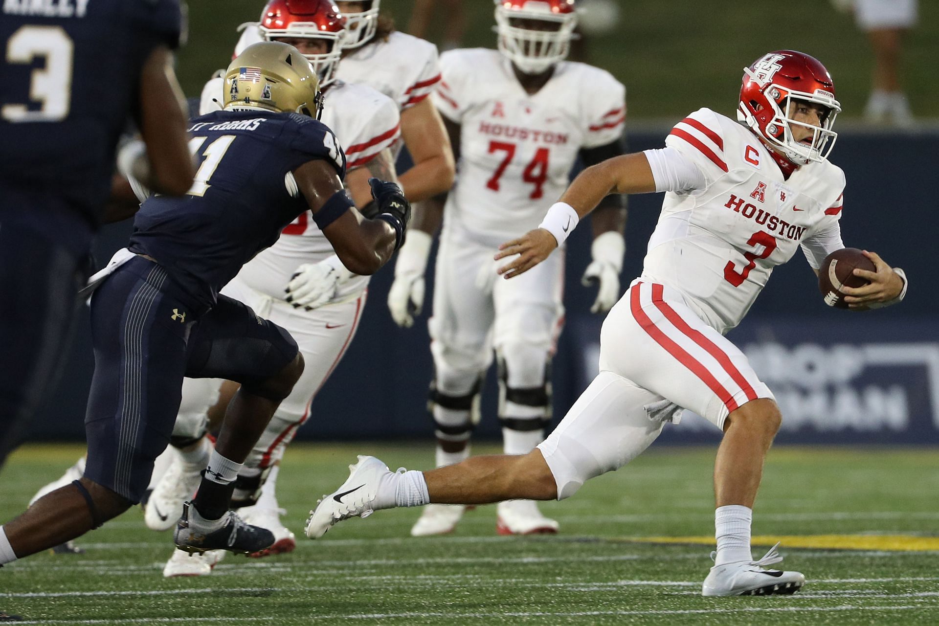 Clayton Tune #3 of the Houston Cougars rushes against the Navy Midshipmen