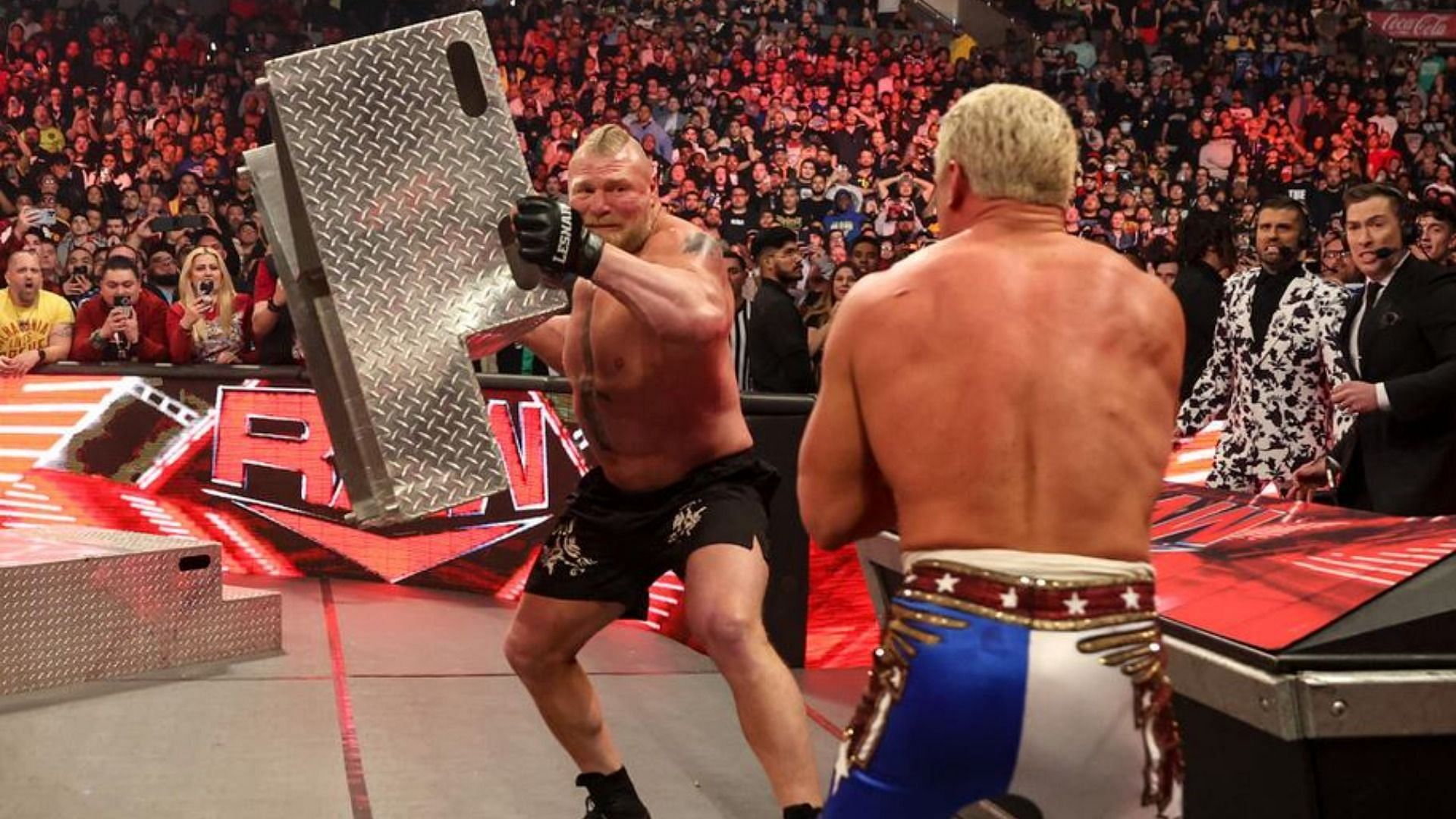 Brock Lesnar takes out Cody Rhodes with a pair of steel steps on WWE RAW.