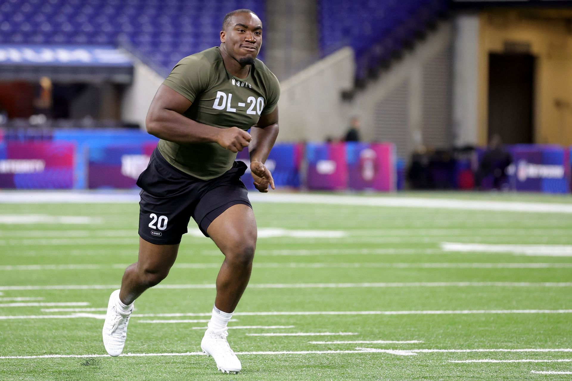 Defensive lineman Adetomiwa Adebawore of Northwestern participates in a drill during the NFL Combine
