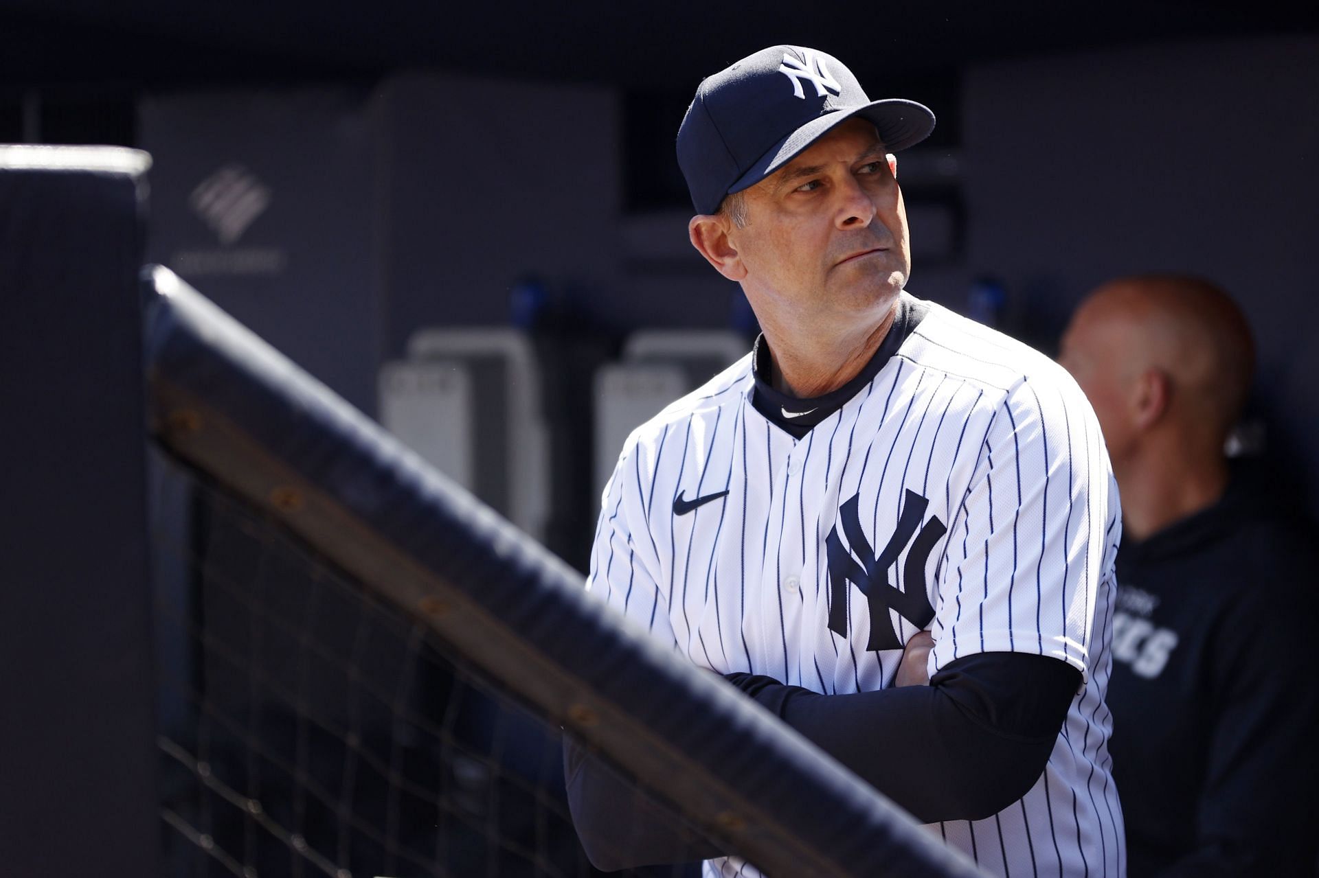 Manager Aaron Boone of the New York Yankees looks on from the dugout gainst the San Francisco Giants