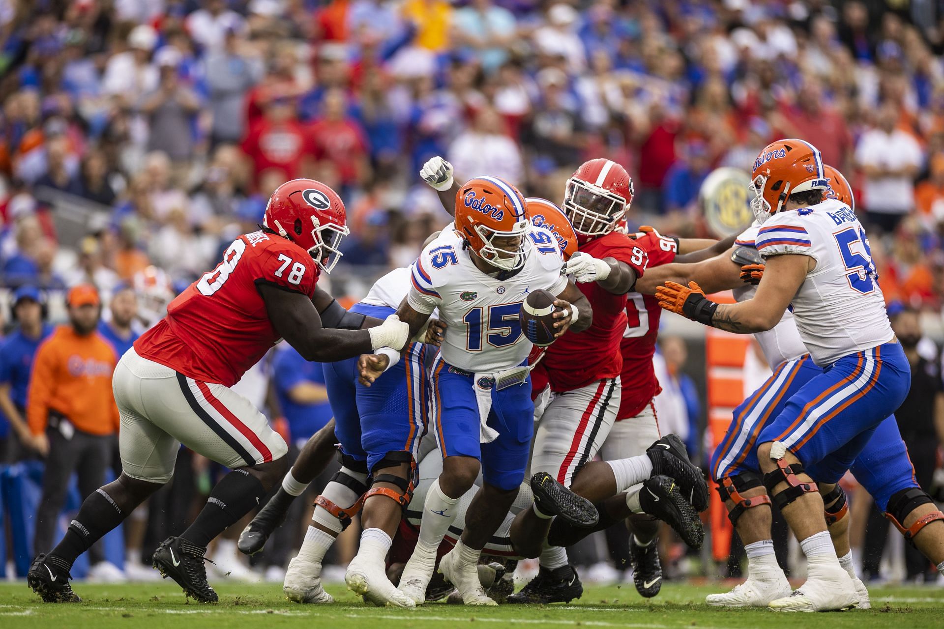 Anthony Richardson #15 of the Florida Gators is pressured by Nazir Stackhouse #78 of the Georgia Bulldogs 