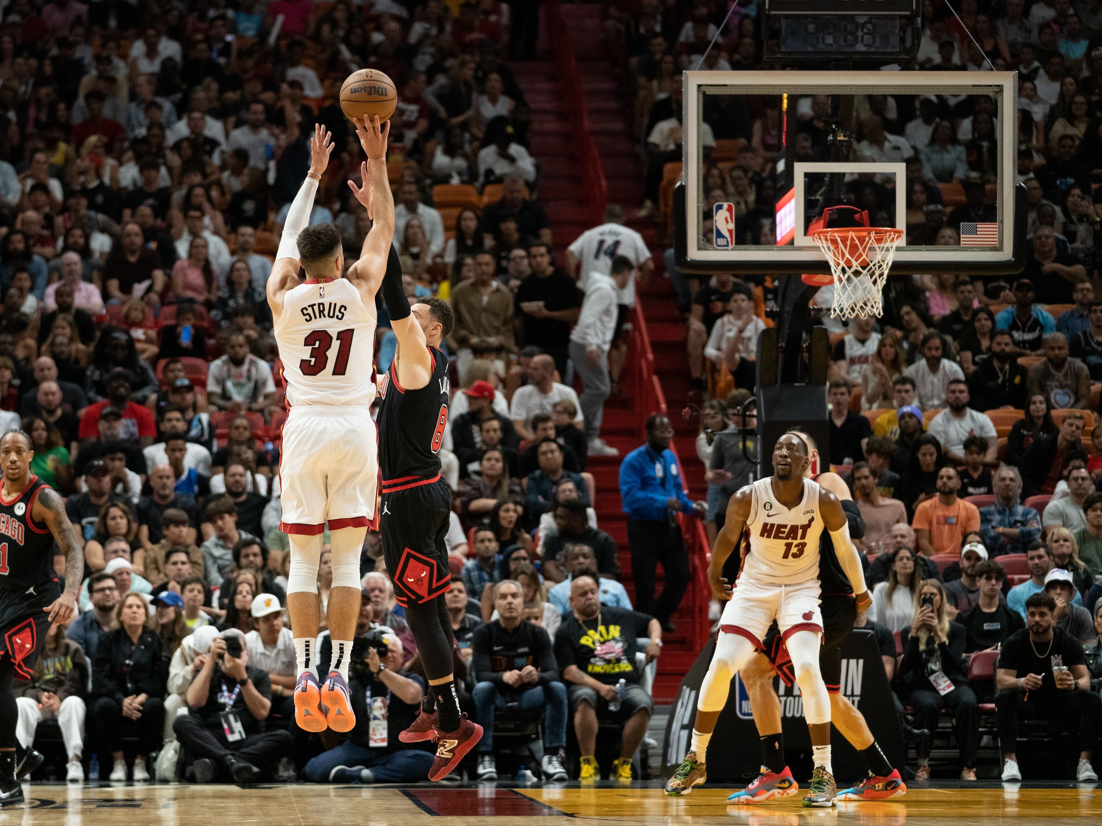 Max Strus of the Miami Heat shooting over Zach LaVine of the Chicago Bulls.