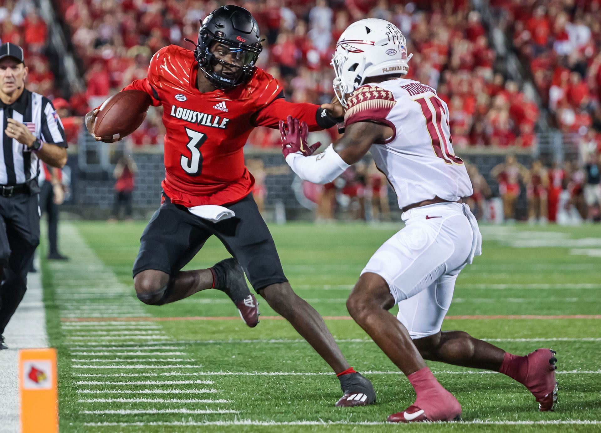 Malik Cunningham #3 of the Louisville Cardinals runs the ball against Jammie Robinson