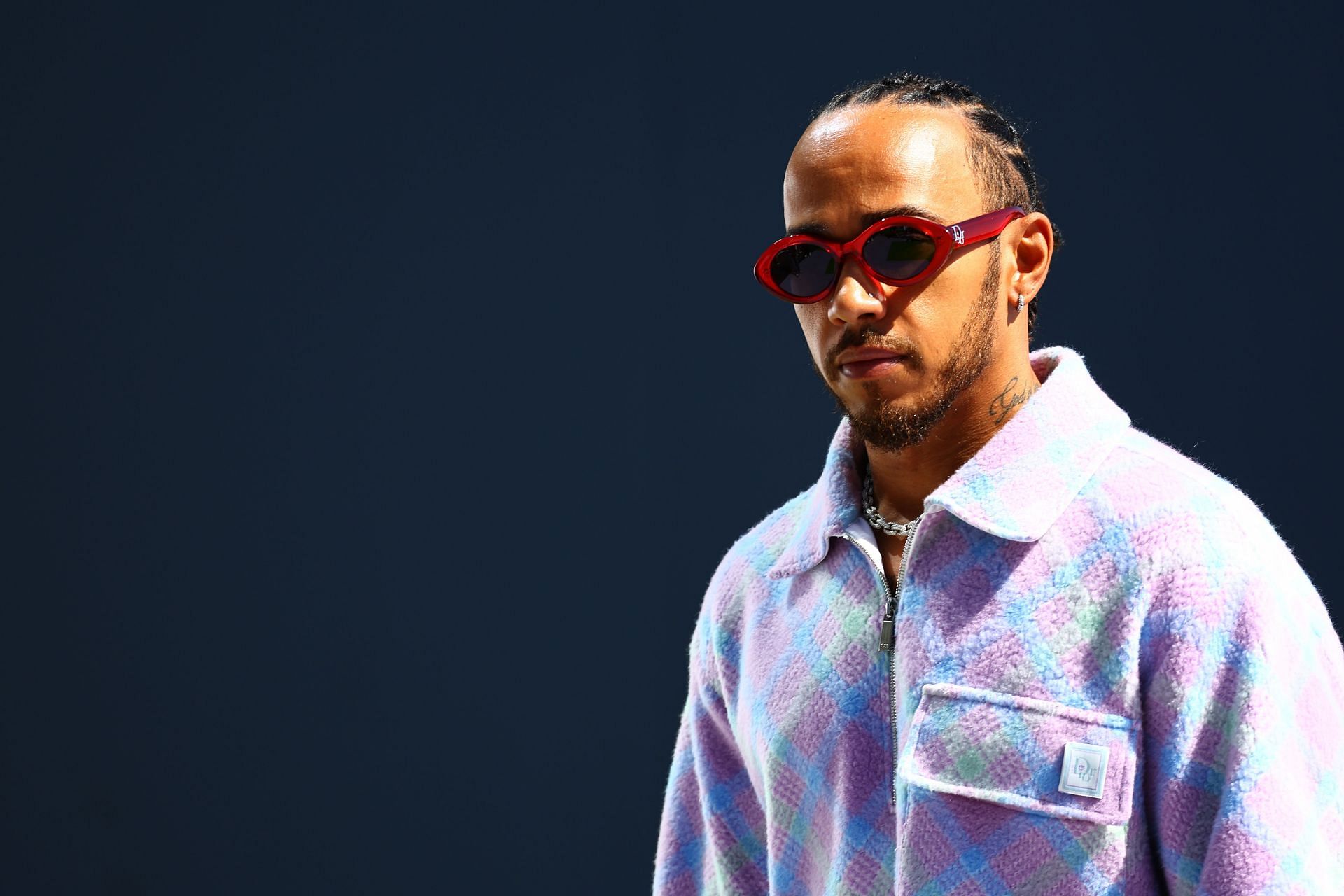 Gucci - Lewis Hamilton was seen in a Fall Winter 2024 look and Gucci Eyewear  sunglasses ahead of the Formula 1 Bahrain Grand Prix. | Facebook