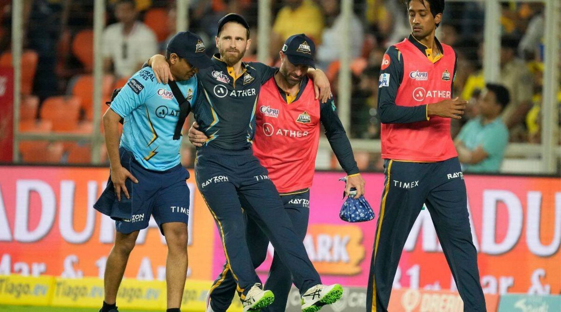 Kane Williamson is carried off the field after injuring his right knee in the opening game of the IPL.